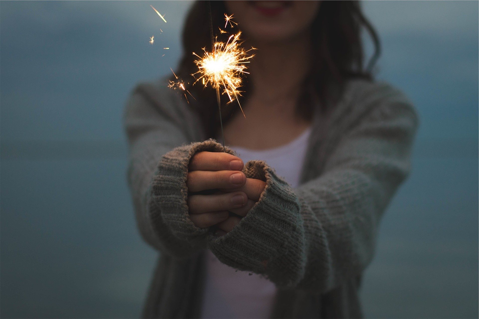 woman holding sparkle